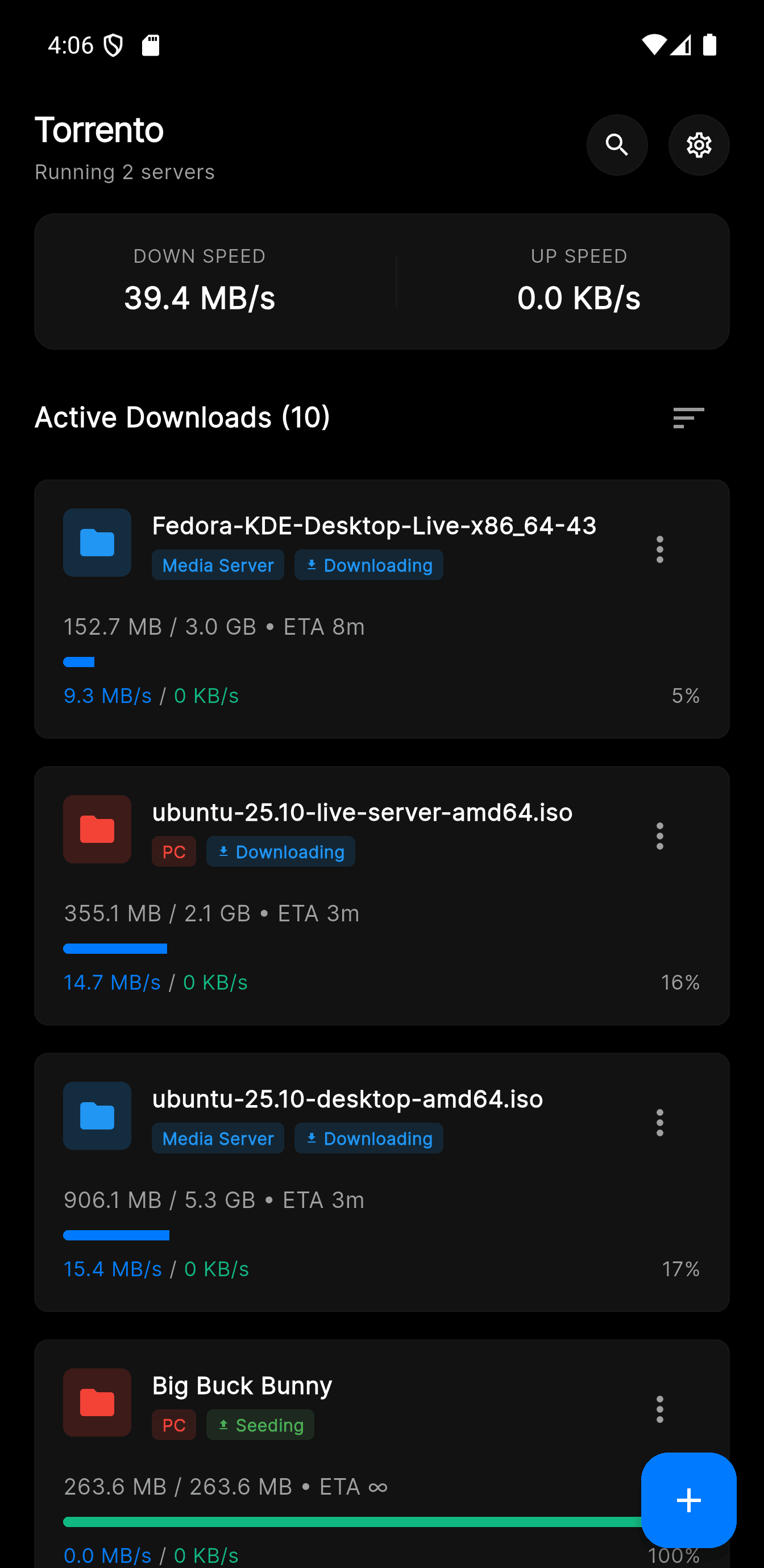 Torrento Android dashboard showing torrent progress, live speeds, and status cards